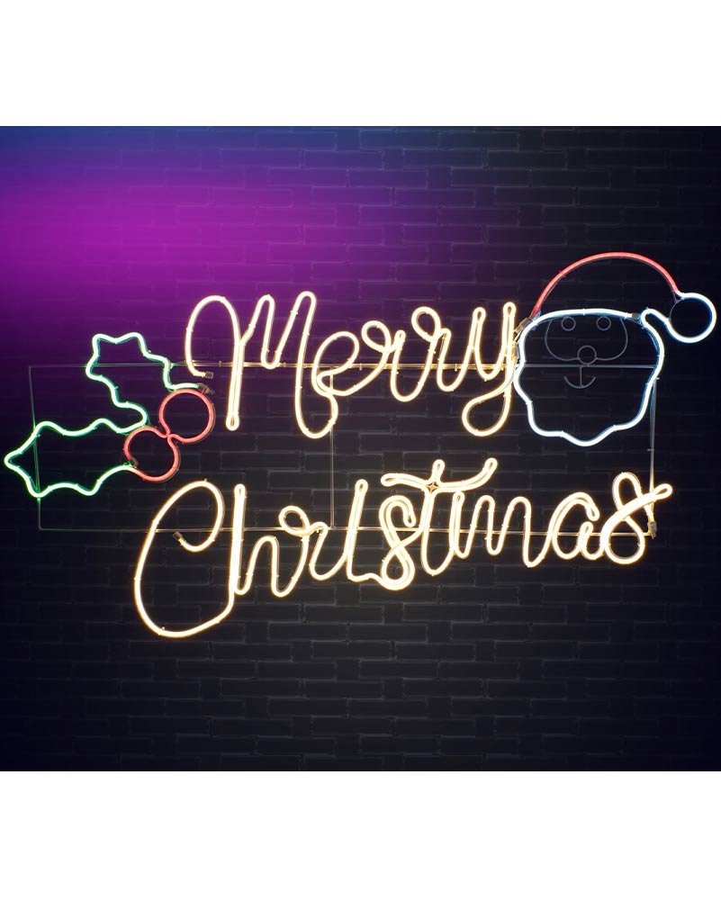A glowing Christmas neon sign on a dark brick wall background, featuring the words “Merry Christmas” in warm yellow script, a Santa face outline in blue and white, and holly leaves in green and red.