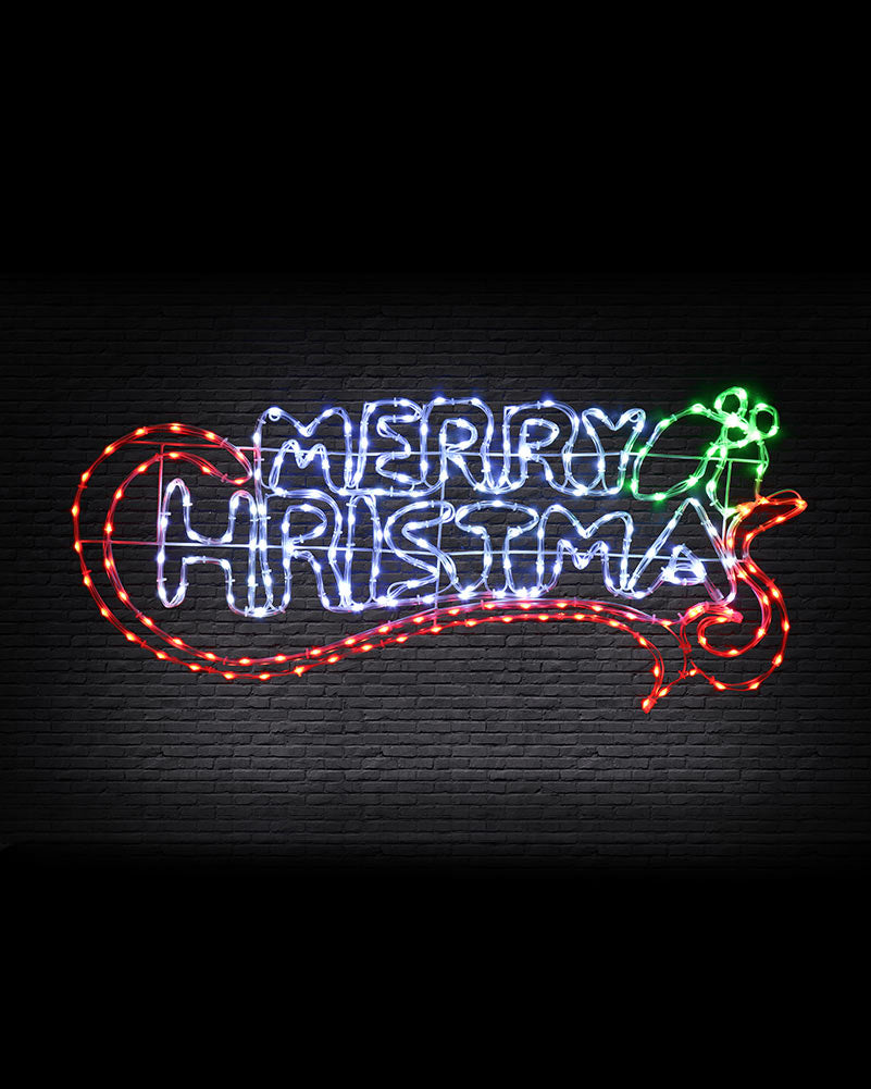 A festive LED neon-style sign reading “MERRY CHRISTMAS” on a dark brick wall background. The lettering is outlined in glowing blue, with a red heart-shaped border on the left, a red decorative flourish at the bottom, and a green angel at the upper right.