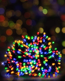 A bundle of multicolor Christmas string lights glowing with red, green, blue, orange, and yellow lights, set against a dark background with colorful bokeh.