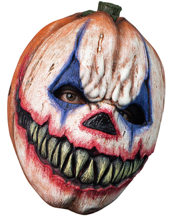 Pumpkin with a painted face resembling a clown on a white background