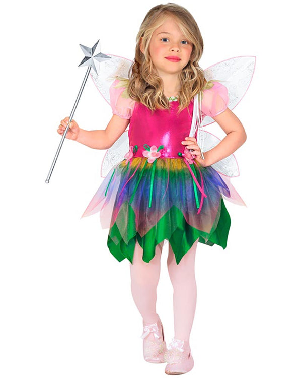 Child in a colorful fairy costume with a wand on a white background