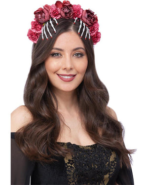 Woman wearing a floral headband with pink flowers on a white background