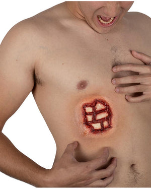 Man with a large wound on his chest on a white background