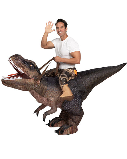 A person wearing an inflatable Tyrannosaurus Rex costume with printed brown T-rex detail and scales. The costume includes attached reigns and faux legs at the waist.