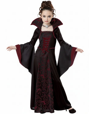 Child wearing a black and red vampire gothic-style dress on a white background
