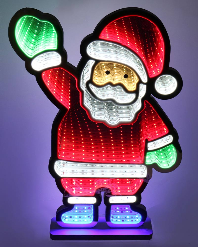 A festive LED light-up Santa Claus figure standing on a base, with red body panels, white trim, a gold-toned face area, and multicolor lights in the gloves and boots, photographed against a dark purple background.
