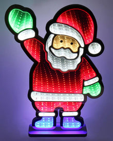 A festive LED light-up Santa Claus figure standing on a base, with red body panels, white trim, a gold-toned face area, and multicolor lights in the gloves and boots, photographed against a dark purple background.