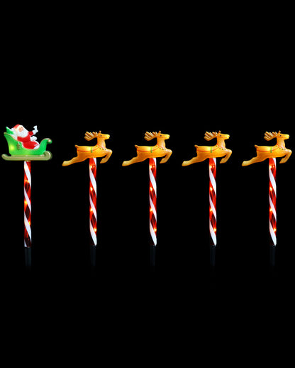 Five Christmas-themed path stakes arranged in a row on a solid black background. 