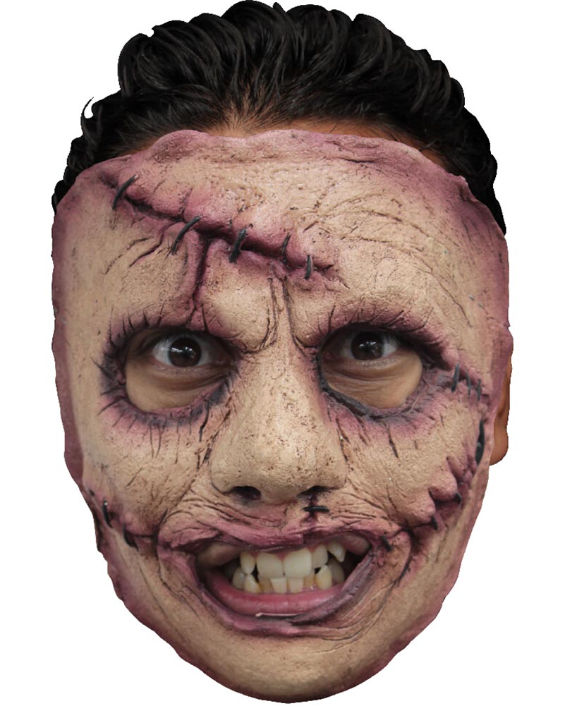 Scary mask with stitching detail and a wide grin on a white background