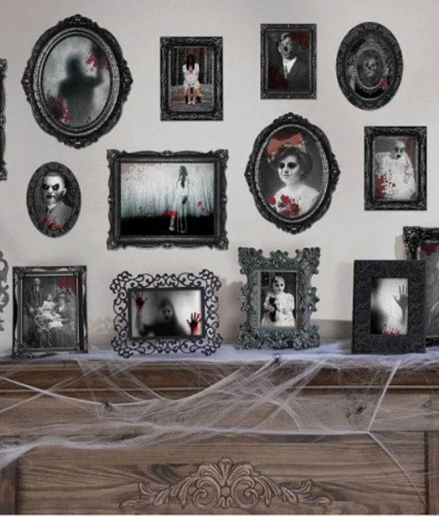 A white wall and wooden fireplace with framed halloween pictures. Click to shop all Halloween Indoor Decor.
