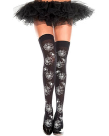 Black thigh-high stockings with a white spiderweb and spider print pattern, shown on a model's legs with a black ruffled tutu skirt and black shoes against a white background.