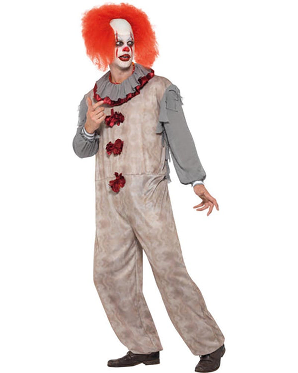 Person wearing a horror clown costume with red hair and makeup on a white background
