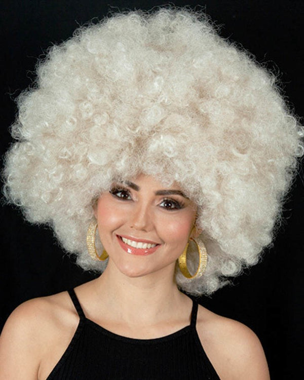 Image of woman wearing large blonde afro wig.