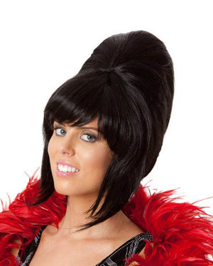 Image of woman wearing tall black 60s beehive wig.