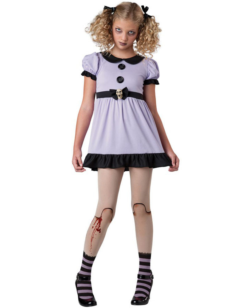 Image of girl wearing doll costume with purple dress, doll tights and striped socks.