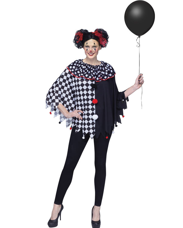 Image of woman wearing black and white printed clown poncho holding black balloon.
