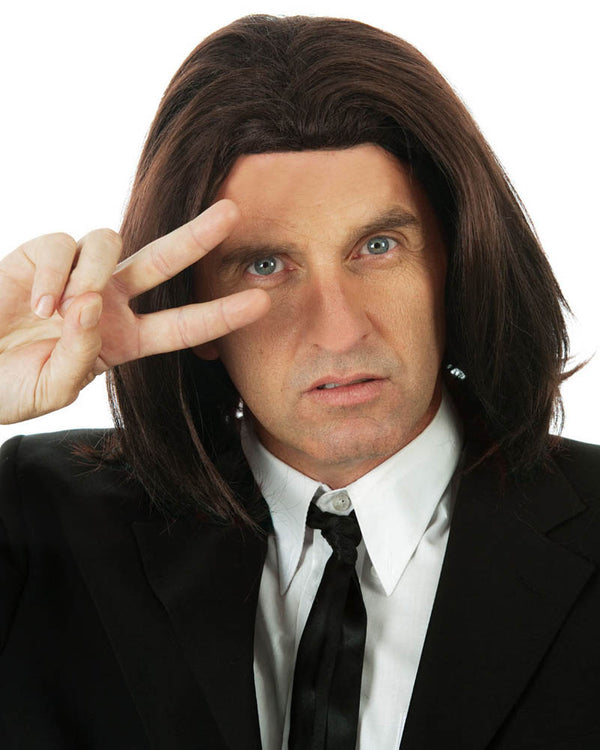 Image of man in suit wearing long brown wig. 