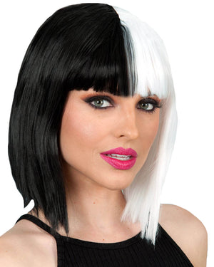 Image of woman wearing bob wig that is half black and half white.
