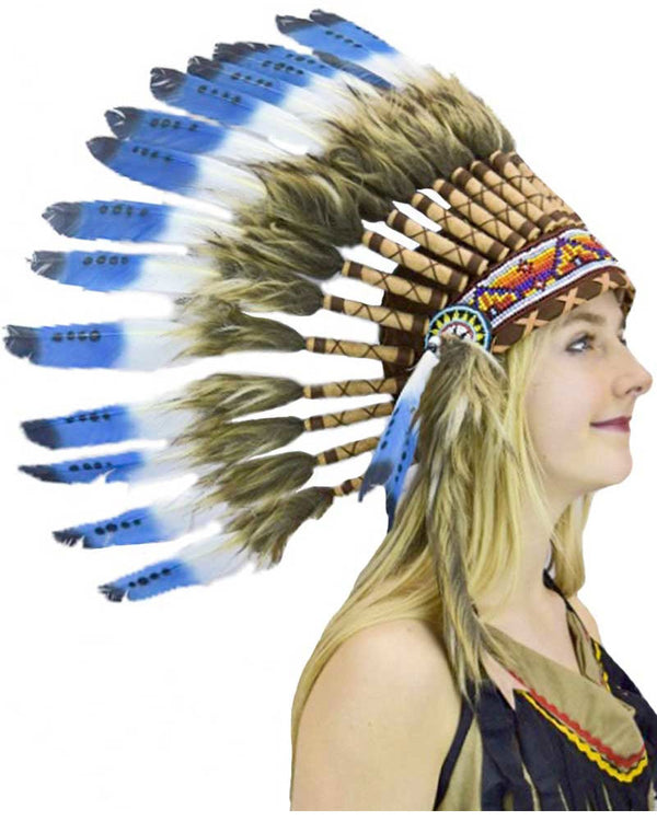 Woman wearing Native American headdress with blue and white feathers.