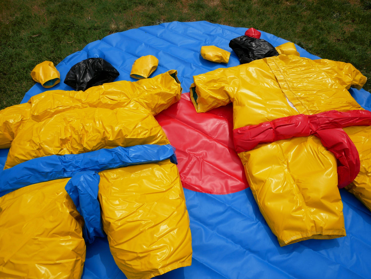 Two PVC and Fabric Adult Sumo Suits with Helmets Gloves and 291cm Mat