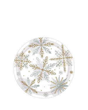 Image of round white plate with gold and silver snowflakes.
