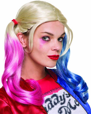 Image of woman wearing blonde Harley Quinn wig with pink and blue tips.